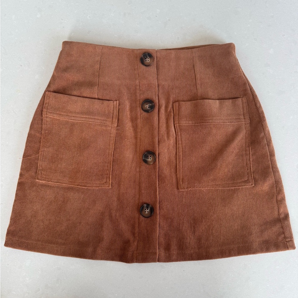 Essue Corduroy Burnt Orange Mid-thigh Skirt with front button detail. Small.